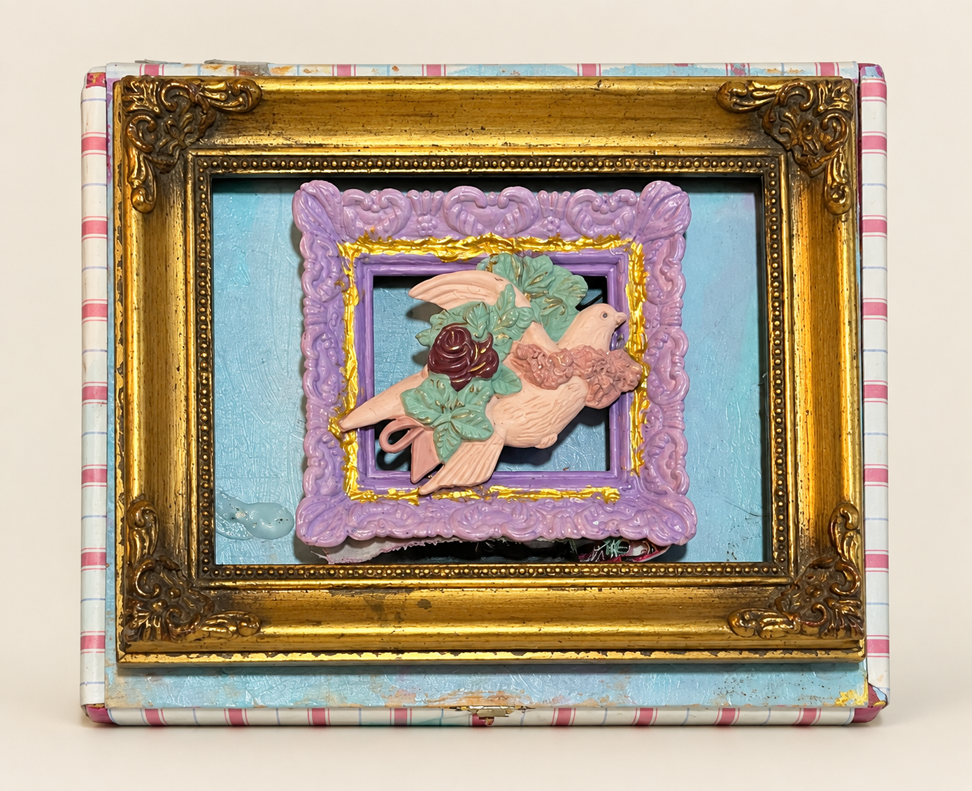 Layered bird and flower relief nested inside lavender and antique-gold frames